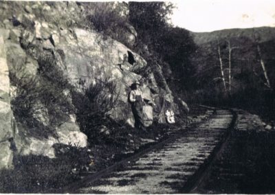 railroad track with person in overalls standing