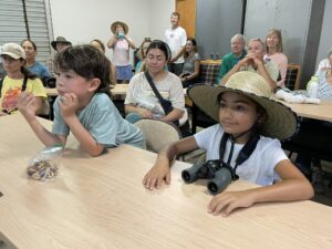 two students observing talk